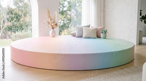 Rainbow colored round platform with pillows and plants indoor