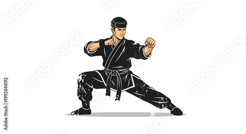 Martial artist in black gi in fighting stance