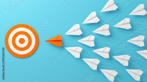 Orange paper airplane leads white planes towards target