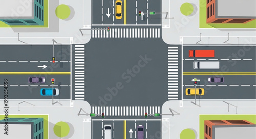 Aerial view of a busy city intersection with traffic and crosswalks.