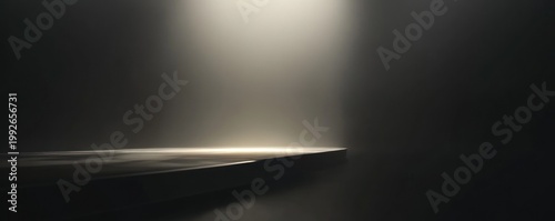 Dramatic Light Beam Illuminating Dark Abstract Textured Surface with Copy Space