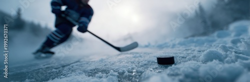 Ice Hockey Player Skating on Frozen Pond with Puck in Foreground