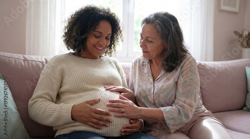 Mother's Day pregnant daughter expectant mom grandmother touching belly together celebrating motherhood love support family bond generational connection warmth hope joy background