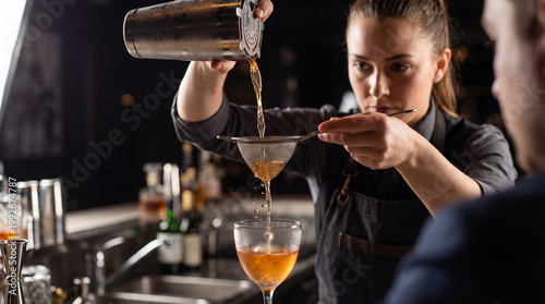 World Cocktail Day bartender straining cocktail with bar strainer showcases professional mixology technique for hospitality industry bar restaurant marketing content
