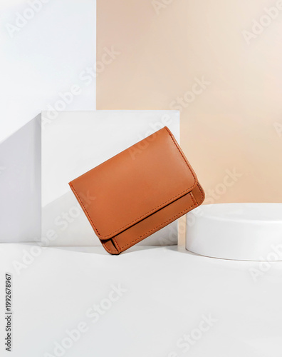 Beautiful tan leather wallet for women on a white and brown background, perfect for leather industry catalog design