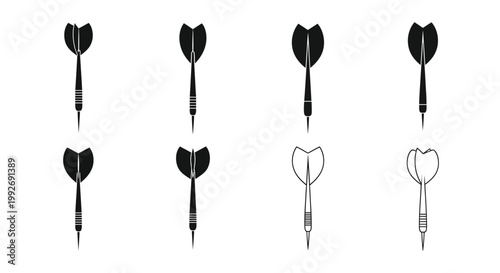 Four dartboard darts in varying styles a striking silhouette