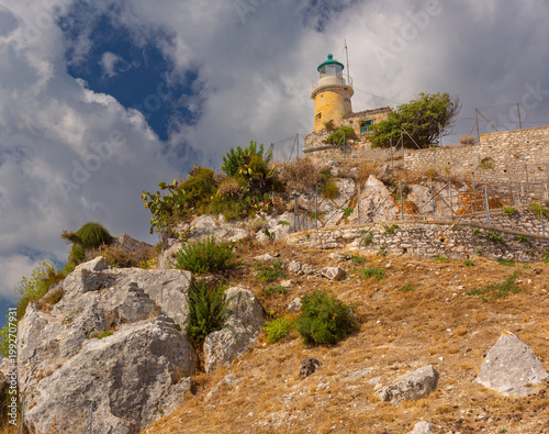 Lighthouse on rocky hillside in Corfu, Greece