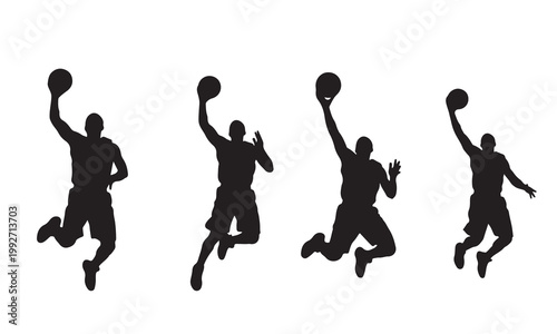Silhouette of four basketball players in various jumping poses during a competitive game