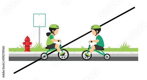 Two young children wearing protective green helmets ride their matching tricycles along a gray sidewalk past a bright red fire hydrant and green grass.