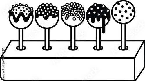 Five decorated cake pops in a holder with confectionery decoration sprinkles chocolate lollipop celebration delicious