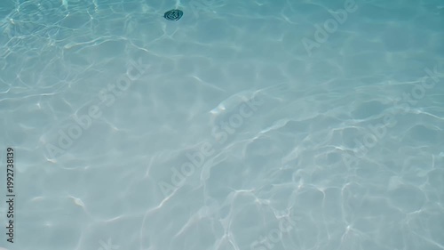 clear blue water with ripples.