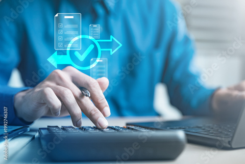 Bilde på lerret User completing refund transaction on calculator and laptop with digital interface, representing payment confirmation, financial processing, ecommerce refund system, and secure transaction