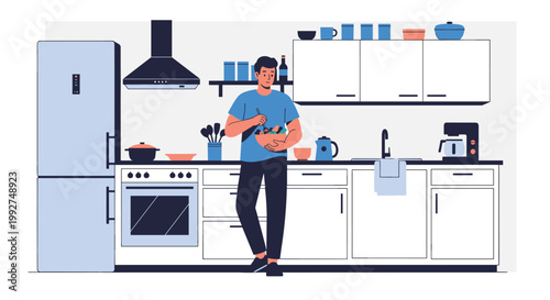 Young man standing in his clean white kitchen and mixing a fresh salad for a healthy lunch or dinner as part of his wellness routine.