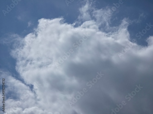 Fluffy White Clouds Floating in Blue Sky