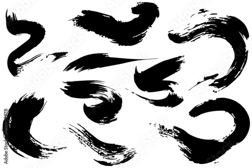 Collection of dynamic abstract black ink brush strokes and calligraphic marks resembling expressive stamps or artistic design elements on a clean white background conveying energy