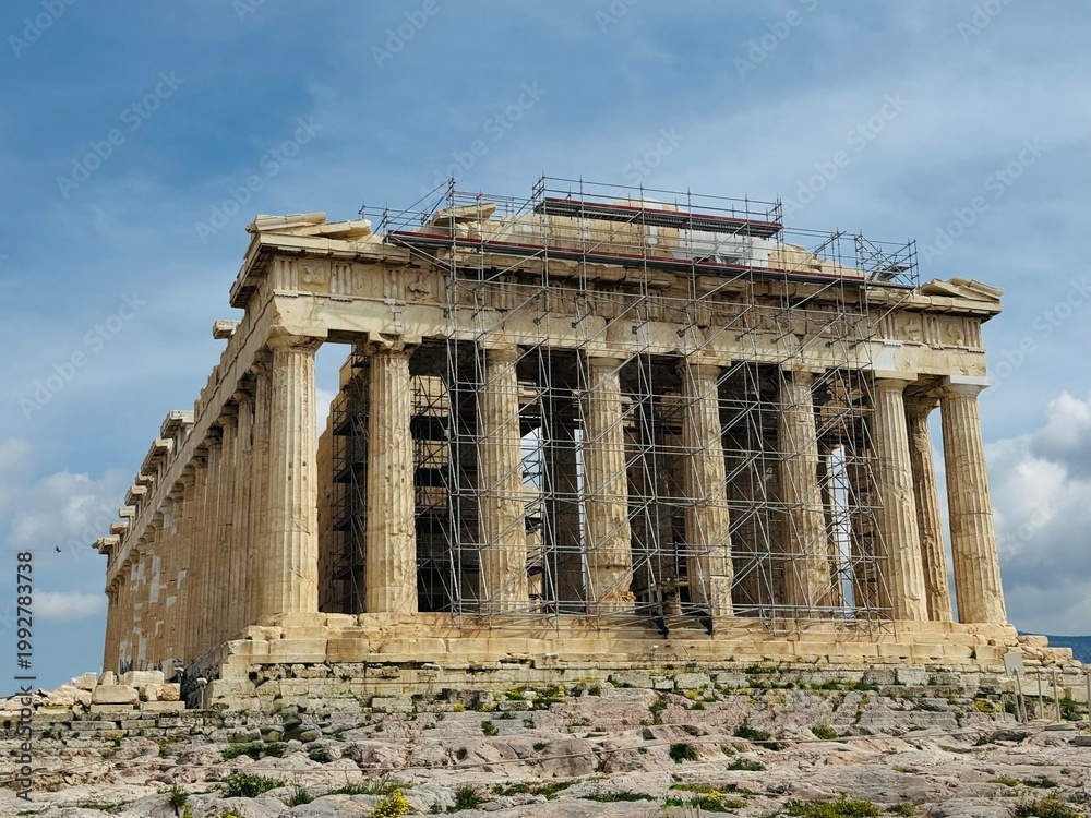 Fototapeta premium The Parthenon on the Acropolis of Athens under restoration, surrounded by scaffolding. Conservation works on the ancient marble temple highlighting preservation of Greek heritage