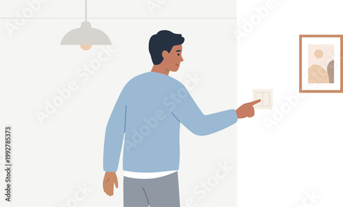 Man hanging picture on wall in living room with lamp