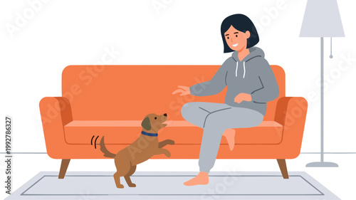 Woman sitting on couch interacts with dog in living room