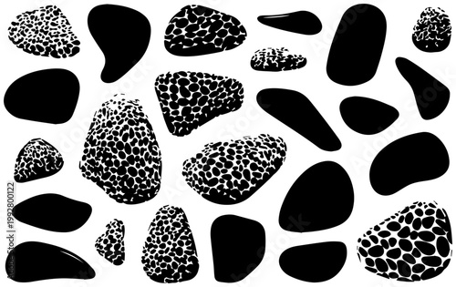 Collection of smooth irregular organically shaped river stones and pebbles in various sizes featuring solid black abstract forms and textured speckled patterns isolated on a clean