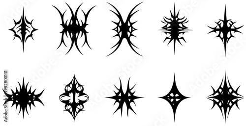 Collection of ten sharp symmetrical spiky tribal inspired graphic shapes and abstract symbols in solid black presented on a clean white background evoking a sense of edgy modern