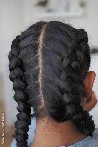 фотографія Hair braiding style with two sections of braids