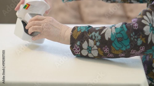Elderly Woman Measuring Blood Pressure in Morning Routine