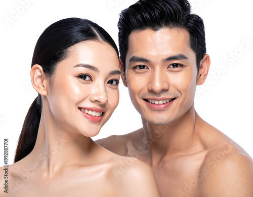 A radiant, close-up shot of a smiling, young couple, shoulders up, looking healthy and content
