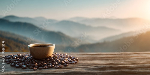 Freshly brewed coffee in cup surrounded by coffee beans on wooden surface with scenic mountain view