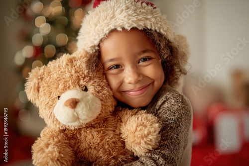 Smiling Child Hugs Teddy Bear on Christmas Morning