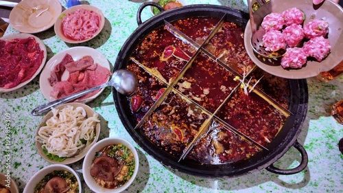 Tourists eating the original spicy dish mala spicy hot pot in Chengdu, China