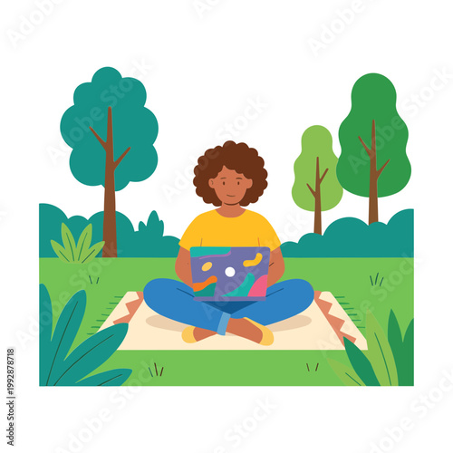A person sits cross-legged on a blanket in a park with trees and grass, holding a colorful laptop.