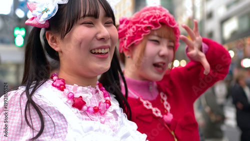 фотографія Two Young Women in Colorful Decora Fashion Smiling in Shibuya Tokyo