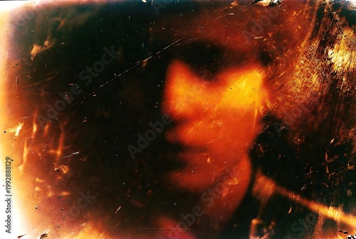 Abstract Grungy Light Effect with Warm Orange and Yellow Hues on Dark Background