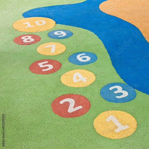 Numbers game from number 1 to number 10 in a colored outdoors children's playground - concept image with copy space