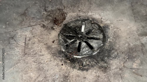 Close up of basement drain on concrete floor highlighting water management and home plumbing infrastructure