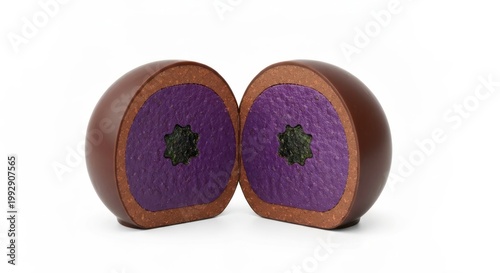 Chocolate sphere halved, revealing a purple center with green detail