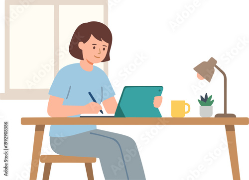 Woman sitting at desk working on laptop with pen and coffee