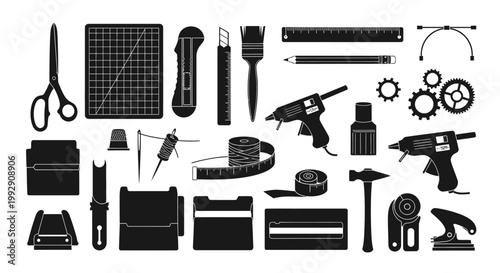Collection of crafting and diy tools including scissors cutting mat utility knife brushes rulers pencils glue guns thread measuring tape thimble hammer and sewing machine parts