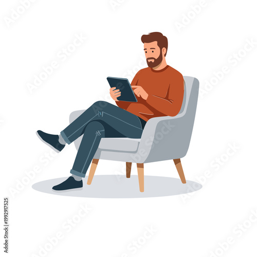 Man sitting on chair reading tablet in casual indoor setting