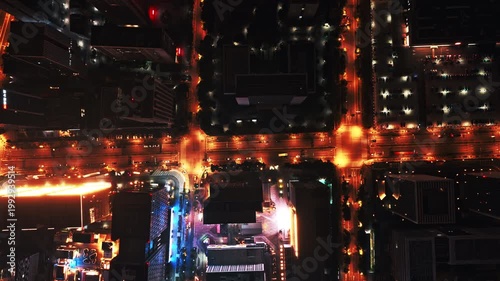 time lapse of traffic in modern city at night, aerial view