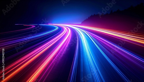 Neon multicolored light trails on dark background.