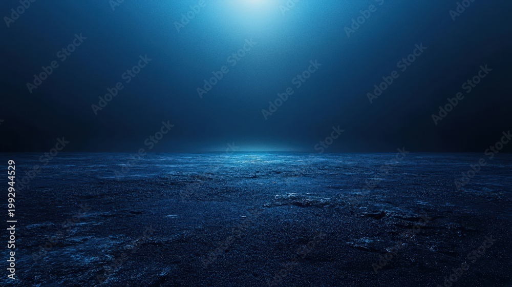 Fototapeta premium Mysterious Deep Blue Ocean Surface with Luminous Sunlight Breaking Through