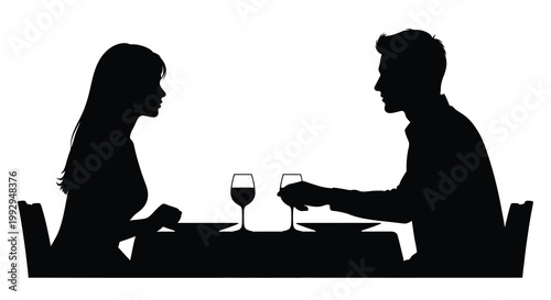 Silhouette of a couple enjoying a romantic dinner together