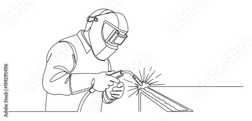 Welder in mask and gloves welds metal, producing sparks, for industrial safety and education.