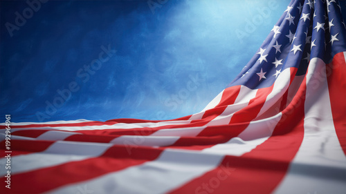 Vibrant American flag beautifully draped and waving against a patriotic blue sky background