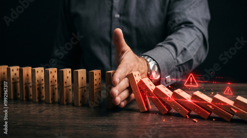 Chain Reaction Control: A focused individual attempts to prevent a domino effect. Emphasizing the significance of risk management and proactive control.
