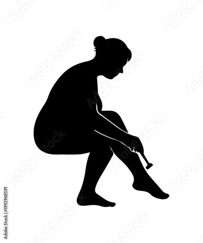 Woman shaving leg for smooth skin hygiene