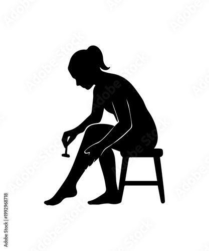 Woman shaving leg with razor for body care and beauty routine