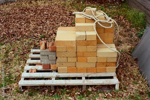 Stacked Fire Bricks on a Wooden Pallet Outdoors