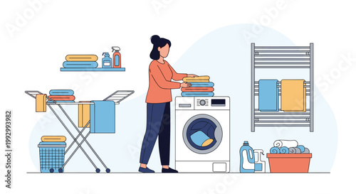 Young woman manages household chores by washing and folding clean laundry in a modern utility room with a washing machine and dryer.